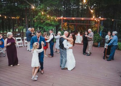 Couples dance after cake cutting on Deck